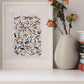 Penguins watercolor art on a shelf with a vase