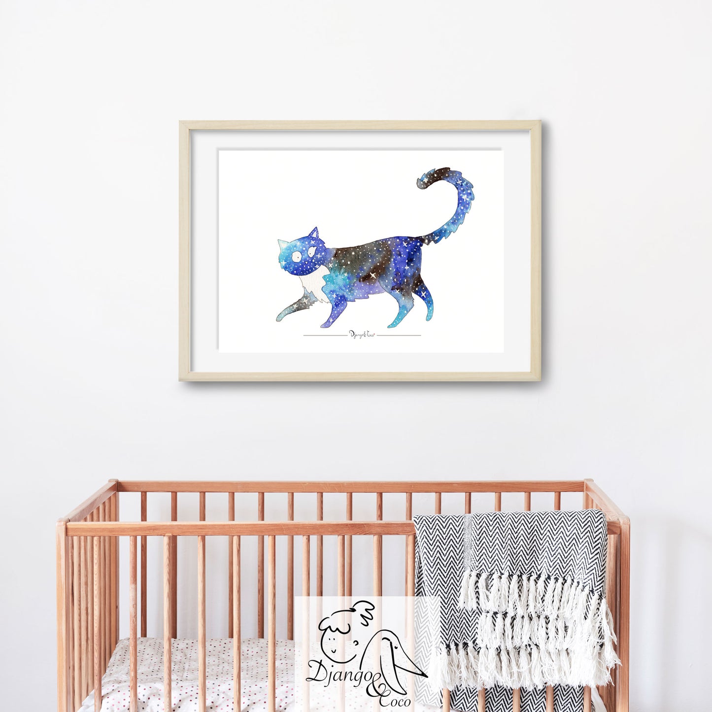 blue cat with stars framed art in a baby's room