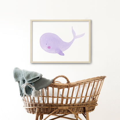 Violet whale print framed in a baby's room